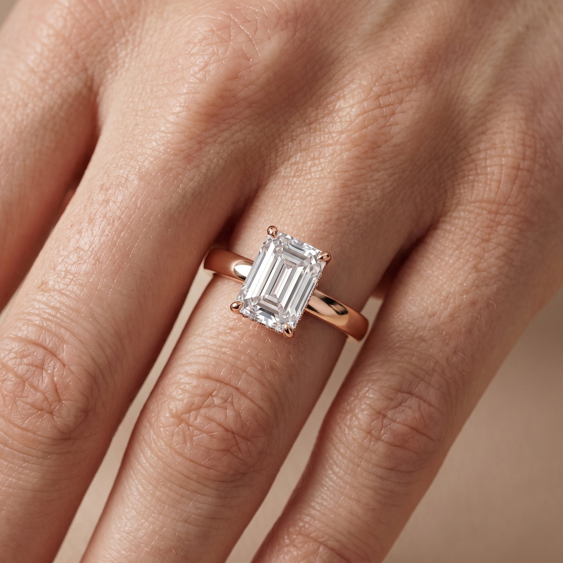 Lara Hidden Halo Emerald Diamond Engagement Ring in Rose Gold - lifestyle.jpg