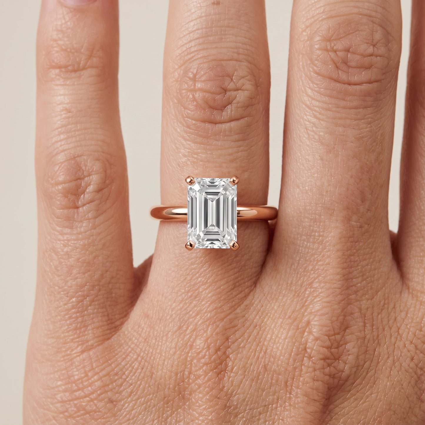 Wren Solitaire Emerald Diamond Ring in Rose Gold - lifestyle.jpg