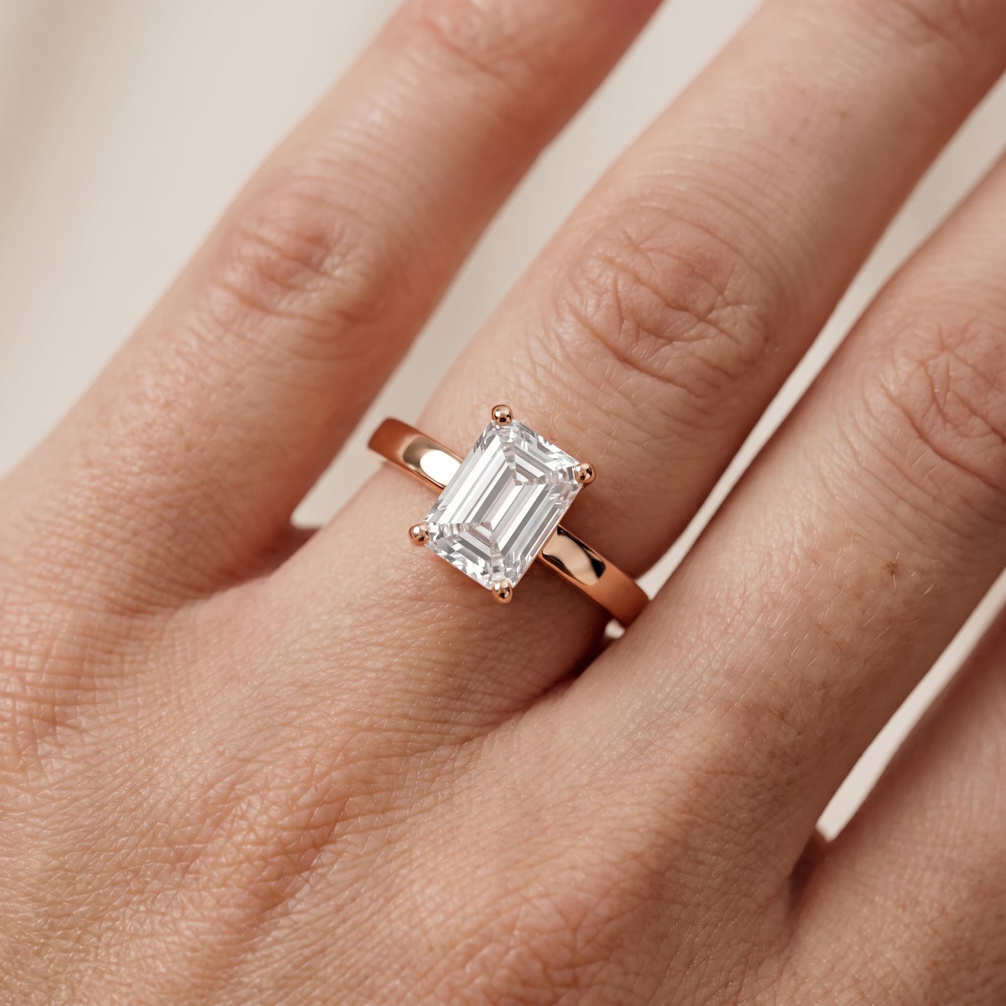 Delia Solitaire Emerald Diamond Engagement Ring in Rose Gold - lifestyle.jpg