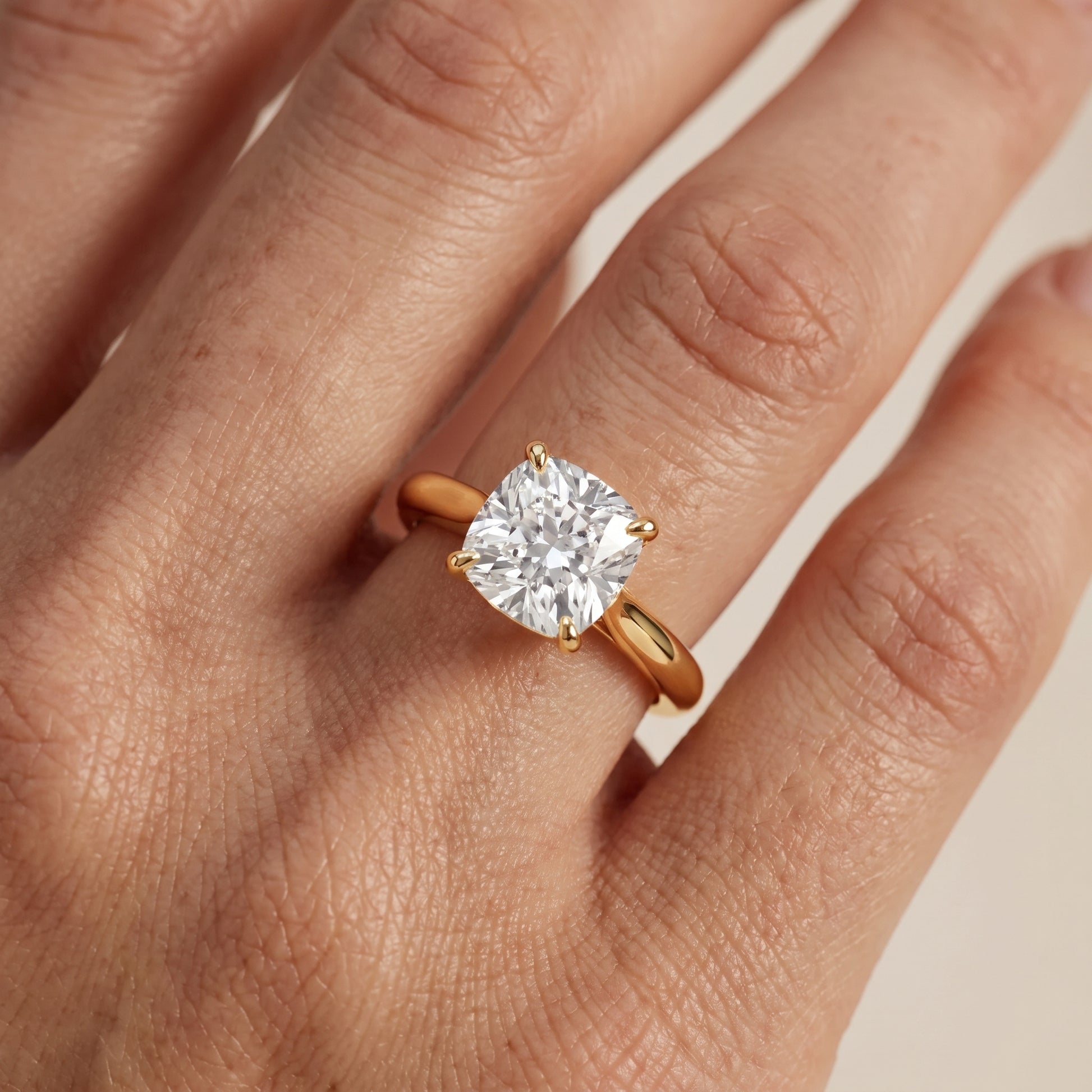 Kalia Knife Edge Solitaire Cushion Diamond Engagement Ring in Yellow Gold - lifestyle.jpg