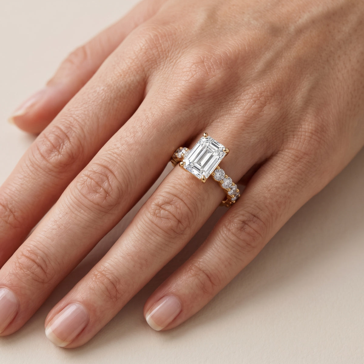 Leta Infinity Pavé Emerald Diamond Engagement Ring in Yellow Gold - lifestyle.jpg