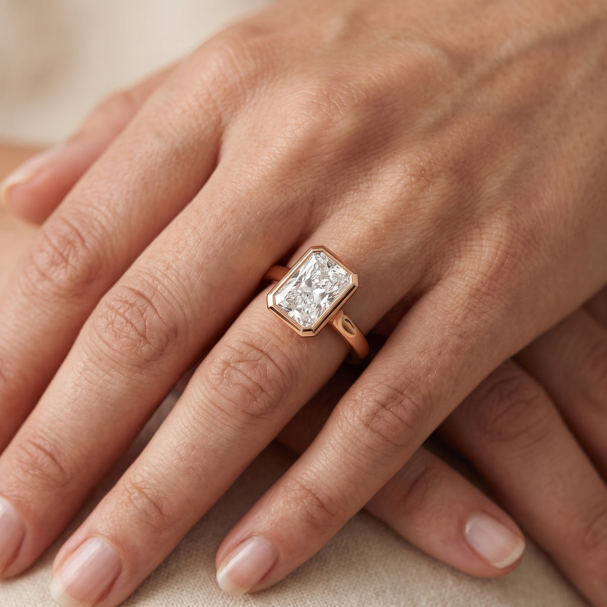 Jolie Bezel Solitaire Radiant Diamond Engagement Ring in Rose Gold - lifestyle.jpg
