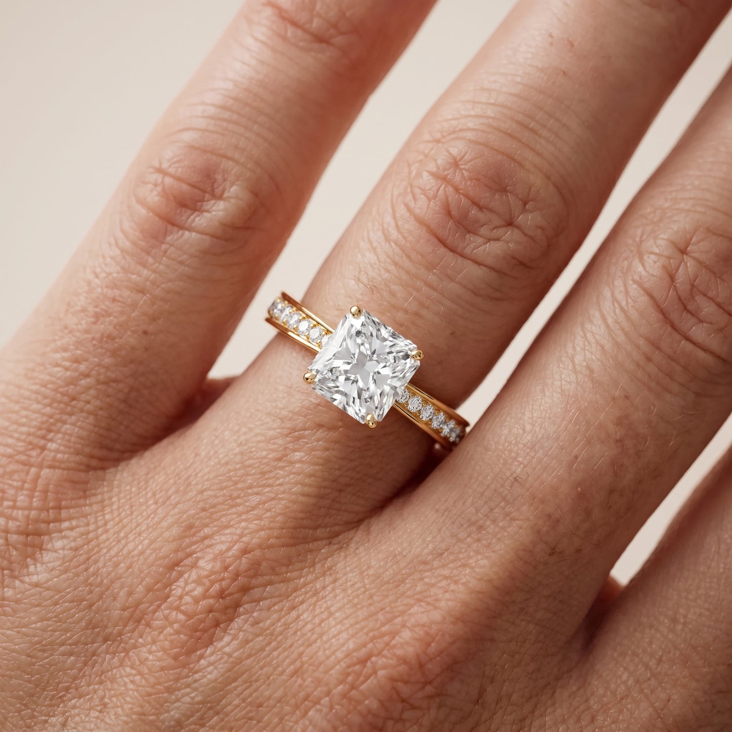 Rhea Sidestone Pavé Radiant Diamond Engagement Ring in Yellow Gold - lifestyle.jpg