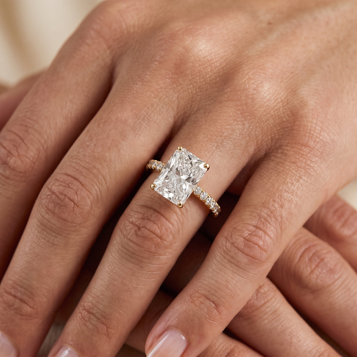 Juna French Pavé Solitaire Radiant Diamond Engagement Ring in Yellow Gold - lifestyle.jpg