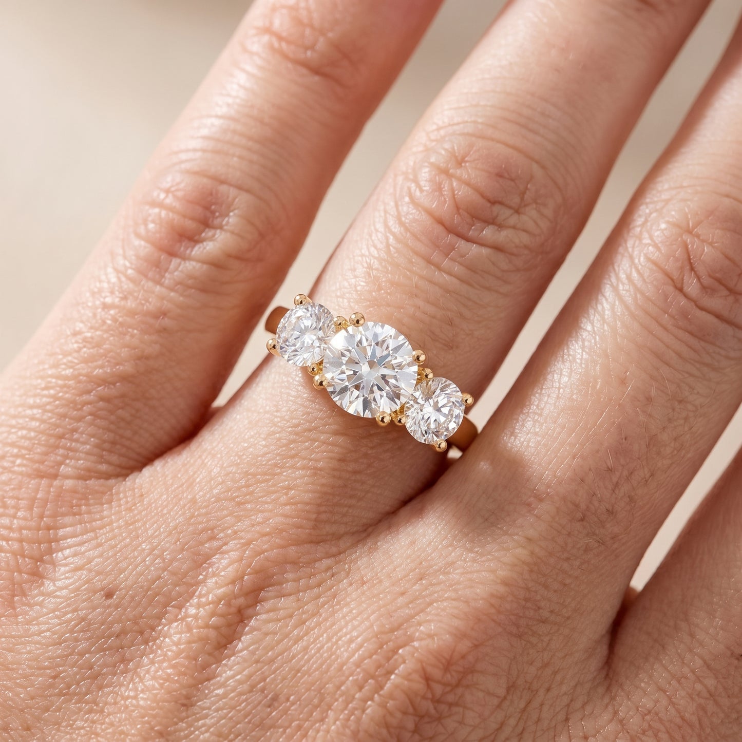 Callie Three-Stone Trellis Round Diamond Engagement Ring in Yellow Gold - lifestyle.jpg