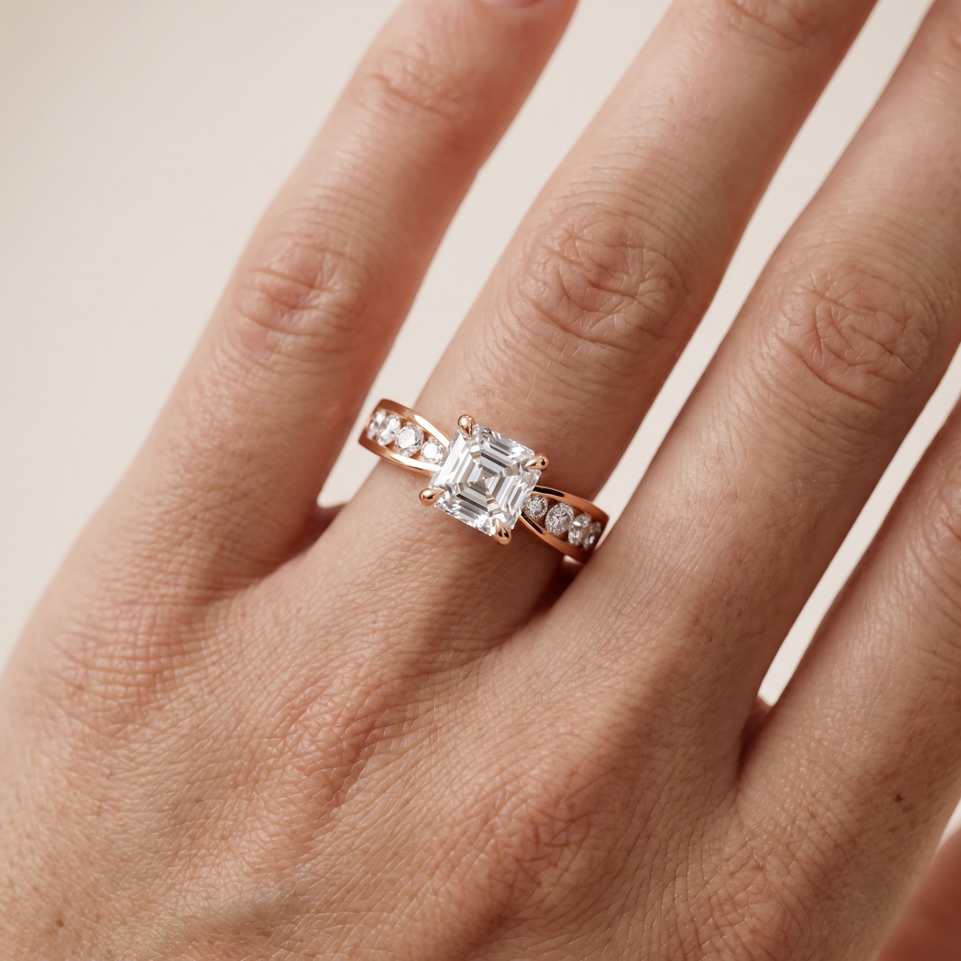 Noor Channel Set Sidestone Asscher Diamond Engagement Ring in Rose Gold - lifestyle.jpg