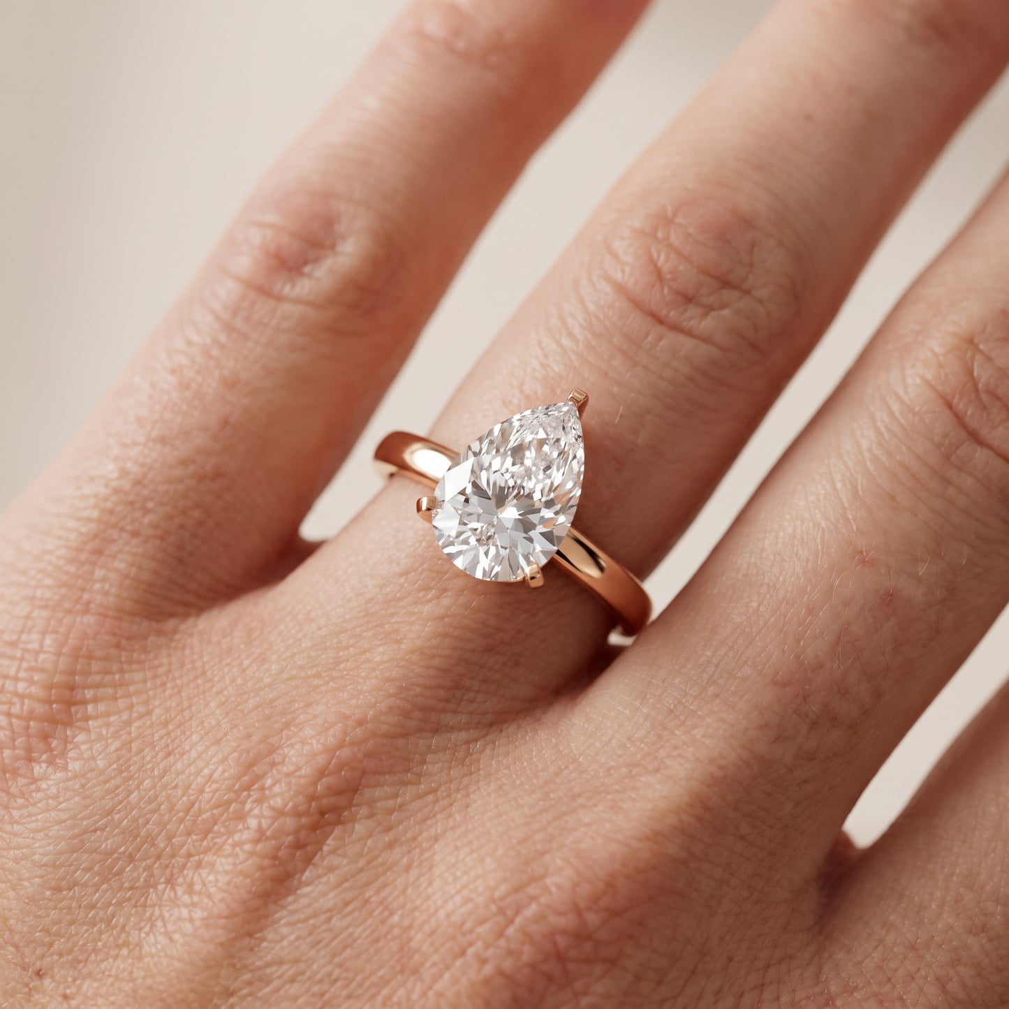 Liana Solitaire Claw Prong Pear Diamond Engagement Ring in Rose Gold - lifestyle.jpg