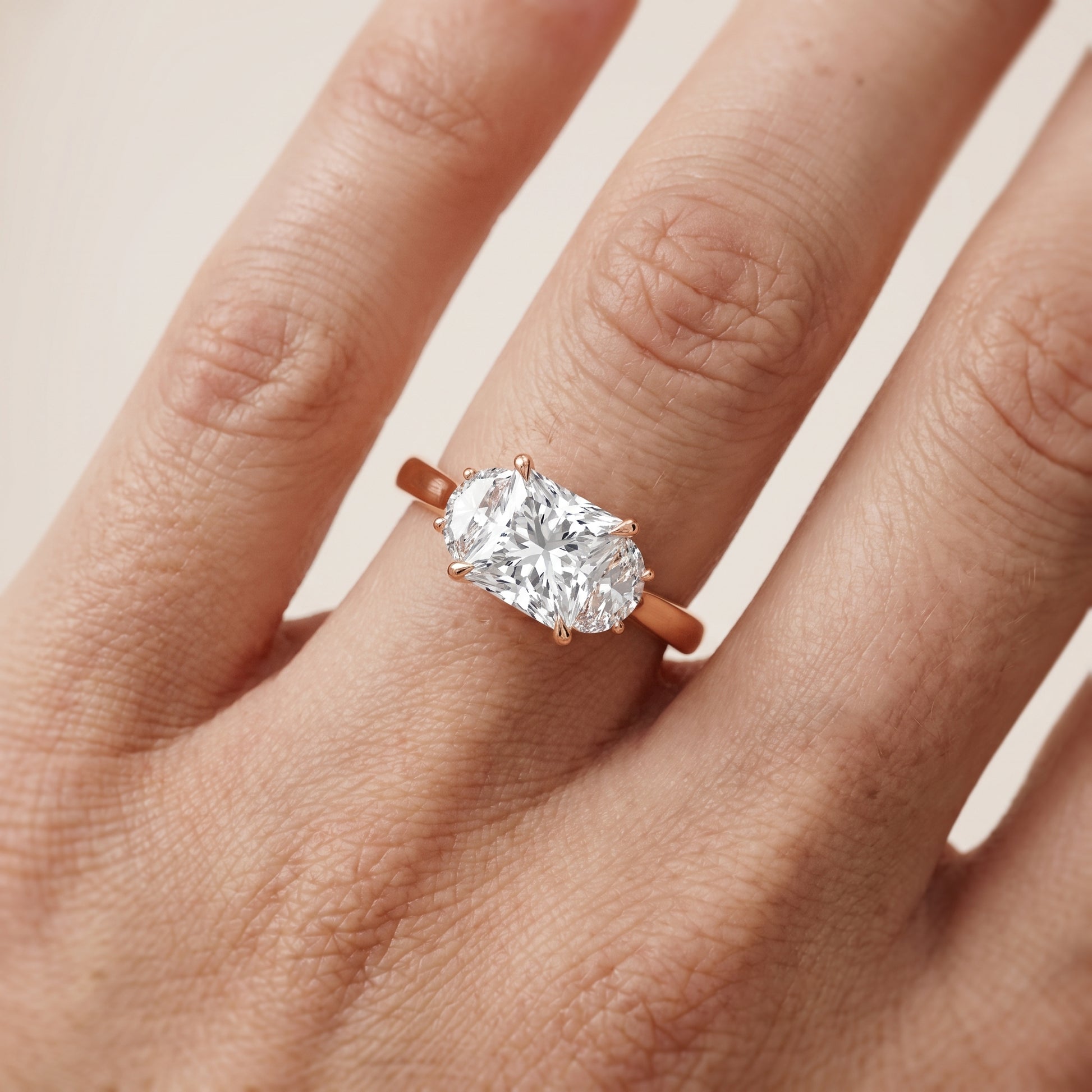 Romy Three-Stone Princess Diamond Engagement Ring in Rose Gold - lifestyle.jpg