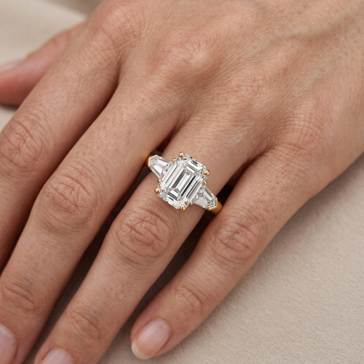 Dorothea Baguette Three-Stone Emerald Diamond Engagement Ring in Silver - lifestyle.jpg