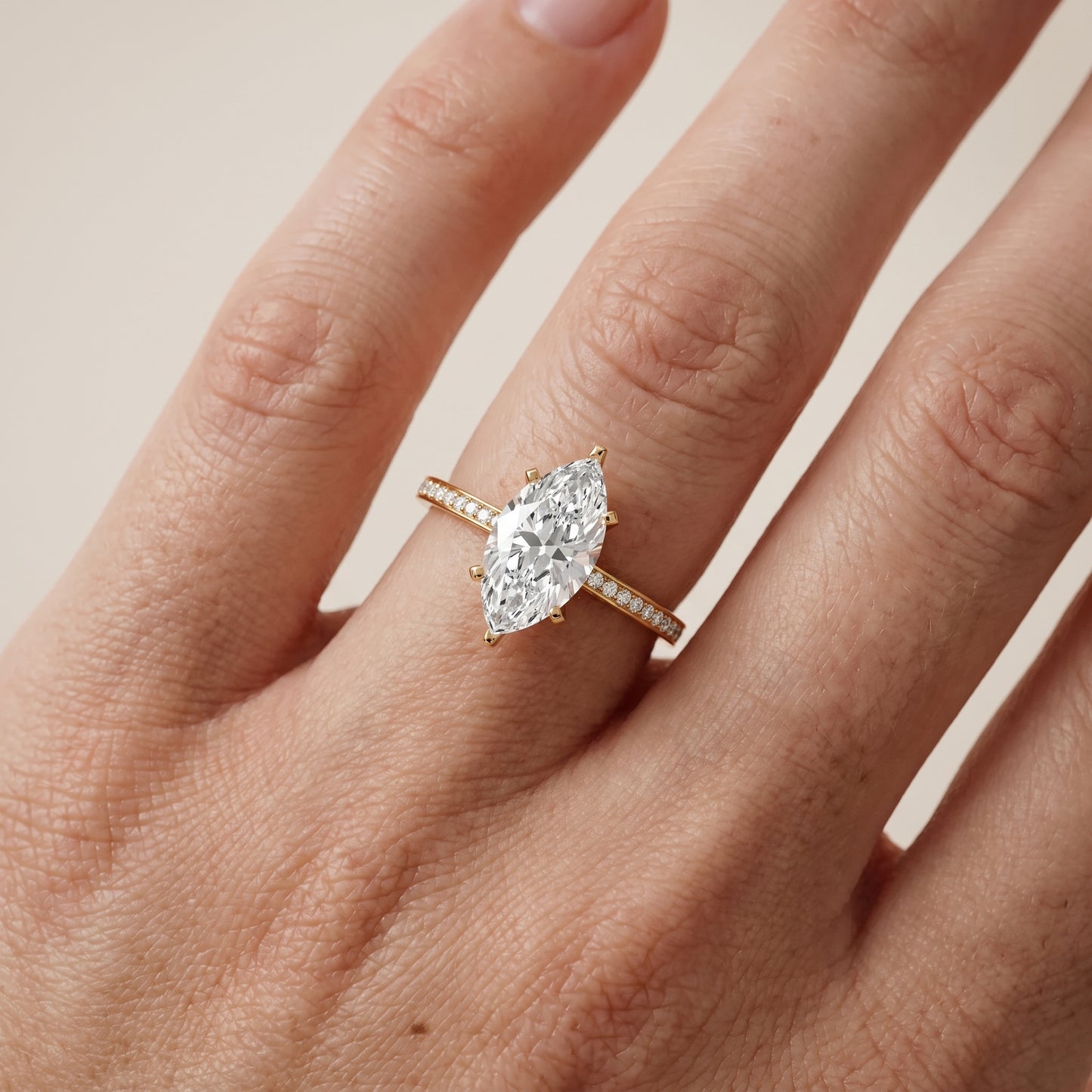 Naia Hidden Halo Marquise Diamond Ring in Yellow Gold - lifestyle.jpg