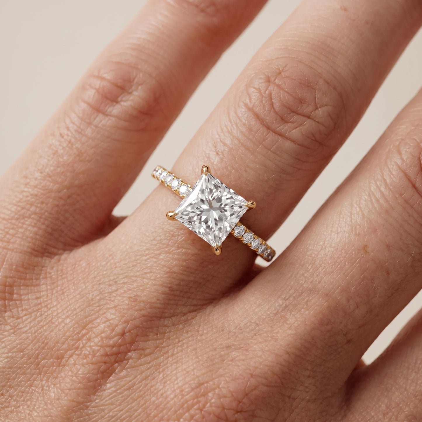 Ione Solitaire Pavé Princess Diamond Engagement Ring in Yellow Gold - lifestyle.jpg