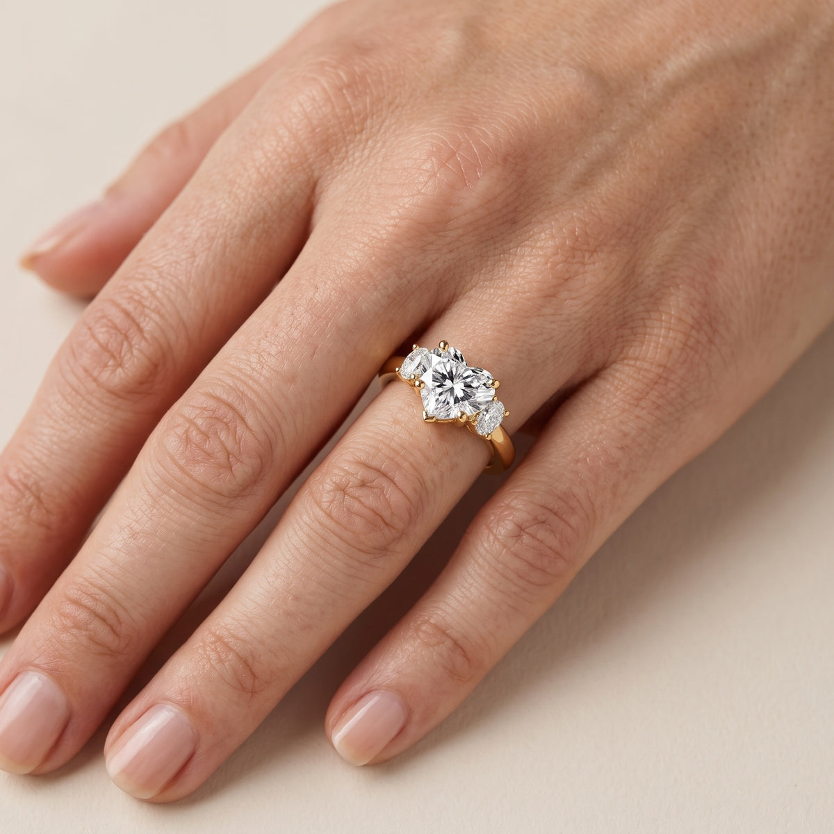 Alya Three-Stone Cathedral Heart Diamond Engagement Ring in Platinum - lifestyle.jpg