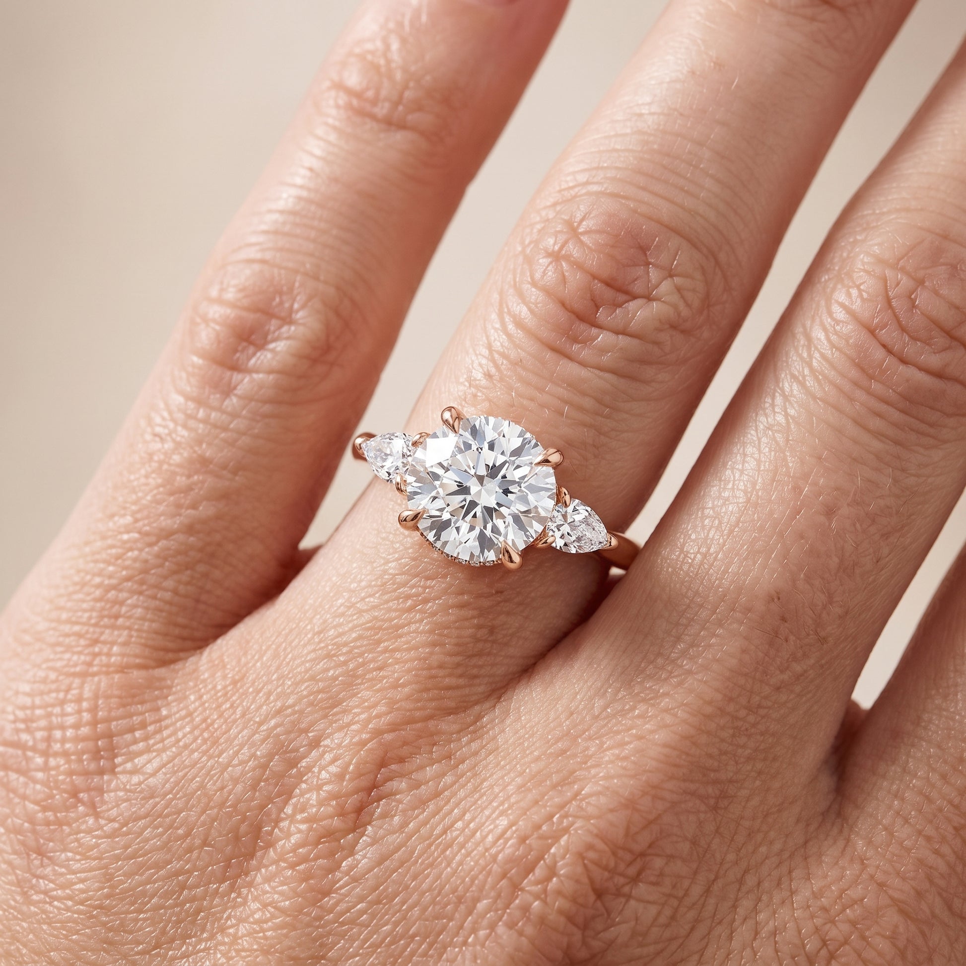 Leila Three-Stone Round Diamond Engagement Ring in Rose Gold - lifestyle.jpg