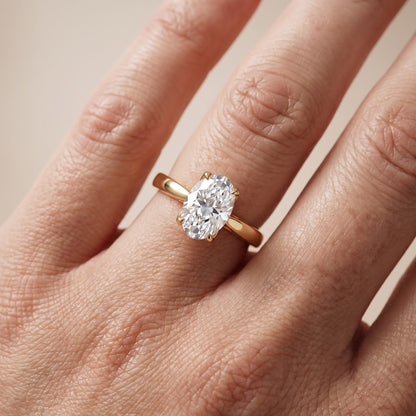 Lucia Solitaire Six-Prong Oval Diamond Engagement Ring in Yellow Gold - lifestyle.jpg