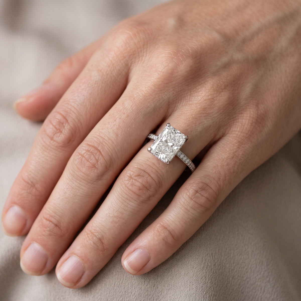 Naia Hidden Halo Radiant Diamond Engagement Ring in White Gold - lifestyle.jpg