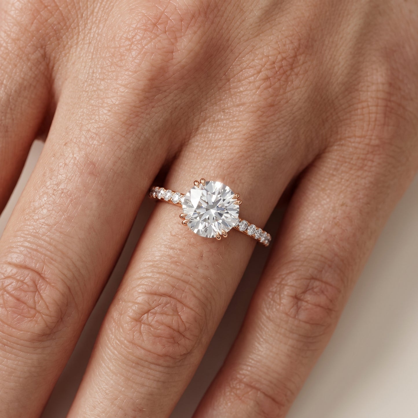 Novara Solitaire Pavé Round Diamond Ring in Rose Gold - lifestyle.jpg