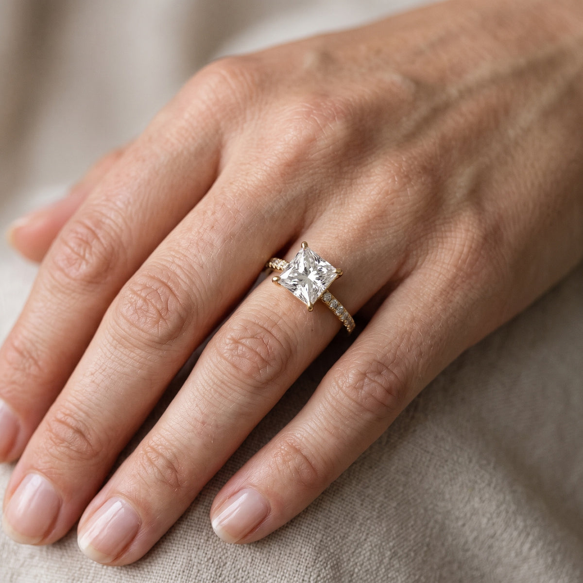 Odelia East-West Pavé Princess Diamond Engagement Ring in Yellow Gold - lifestyle.jpg