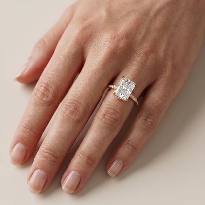 Naia Hidden Halo Radiant Diamond Engagement Ring in Yellow Gold - lifestyle.jpg