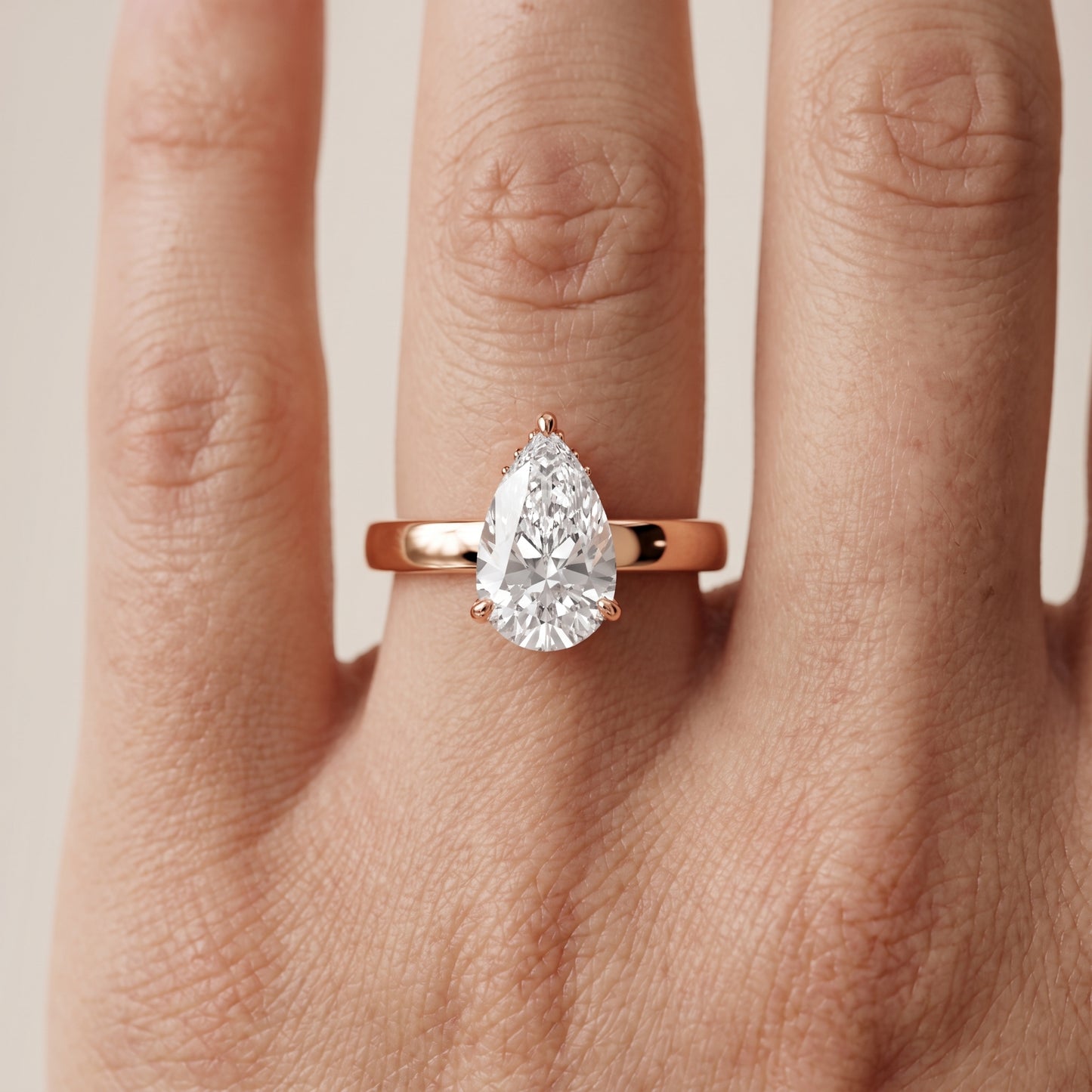 Lara Hidden Halo Pear Diamond Engagement Ring in Rose Gold - lifestyle.jpg