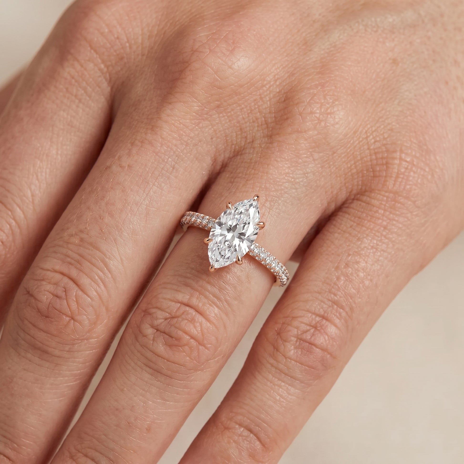 Della Hidden Halo Pavé Marquise Diamond Engagement Ring in Rose Gold - lifestyle.jpg
