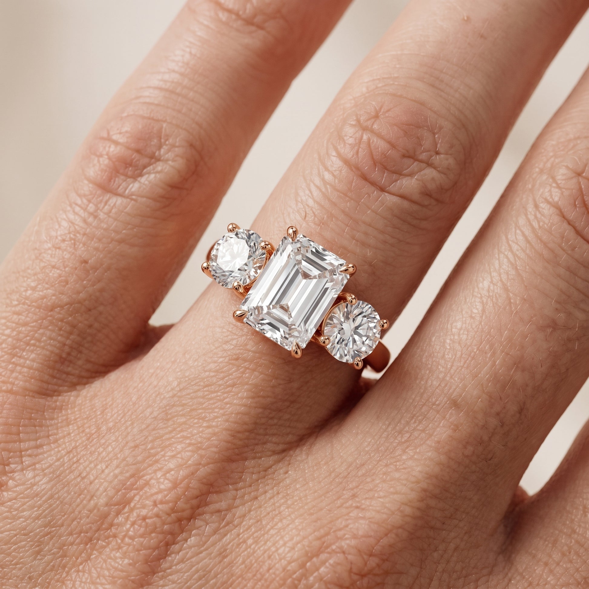 Esme Three-Stone Tapered Emerald Diamond Ring in Rose Gold - lifestyle.jpg