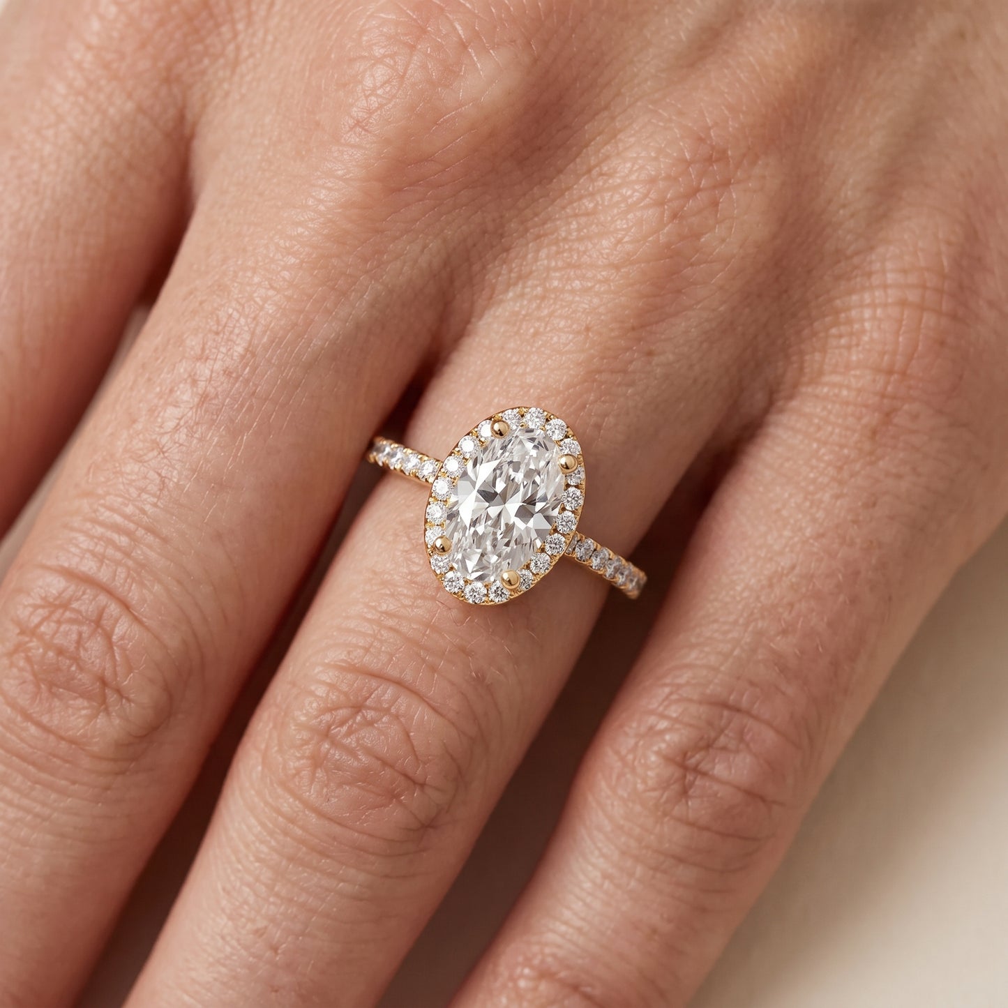 Sophie Halo Pavé Oval Diamond Ring in Yellow Gold - lifestyle.jpg