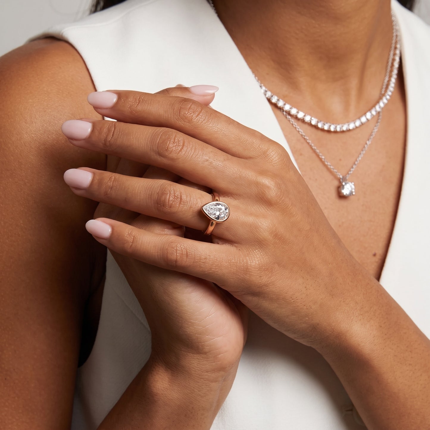 Jolie Bezel Solitaire Pear Diamond Engagement Ring in Rose Gold - model.jpg