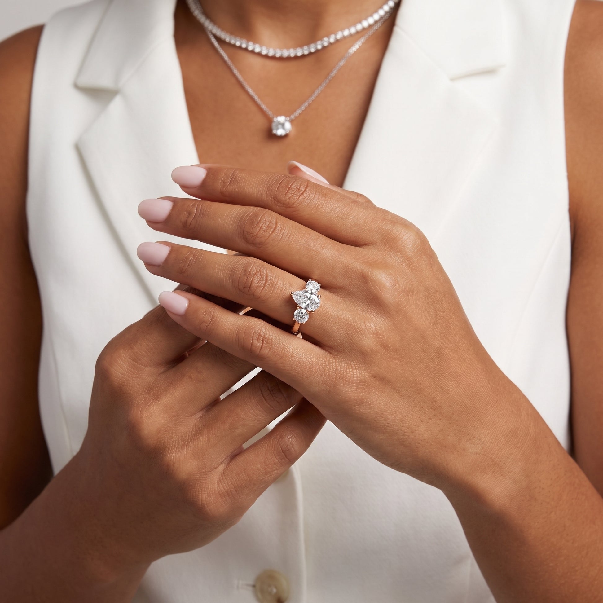 Callie Three-Stone Trellis Pear Diamond Engagement Ring in Rose Gold - model.jpg