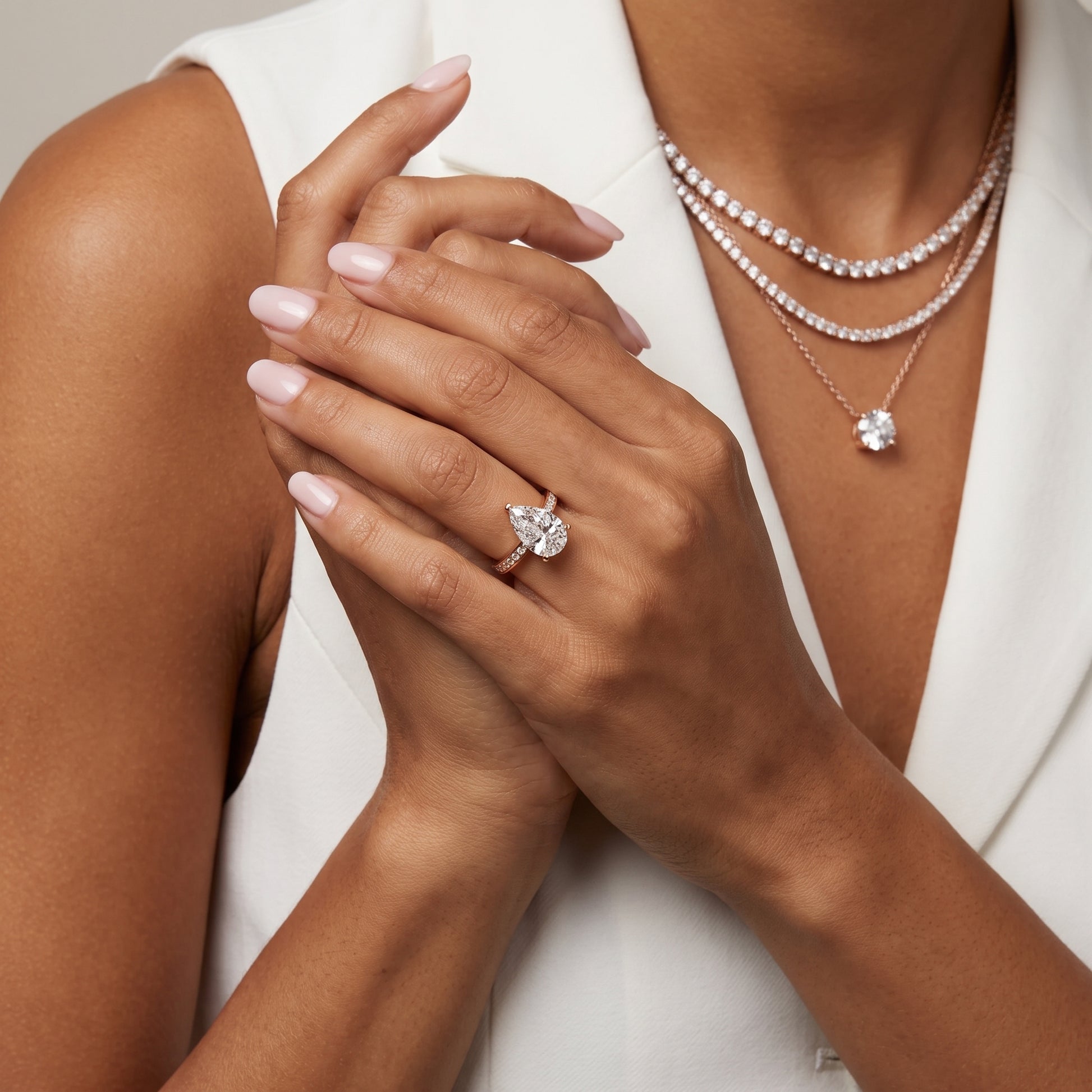 Tessa Solitaire Channel Set Pear Diamond Engagement Ring in Rose Gold - model.jpg