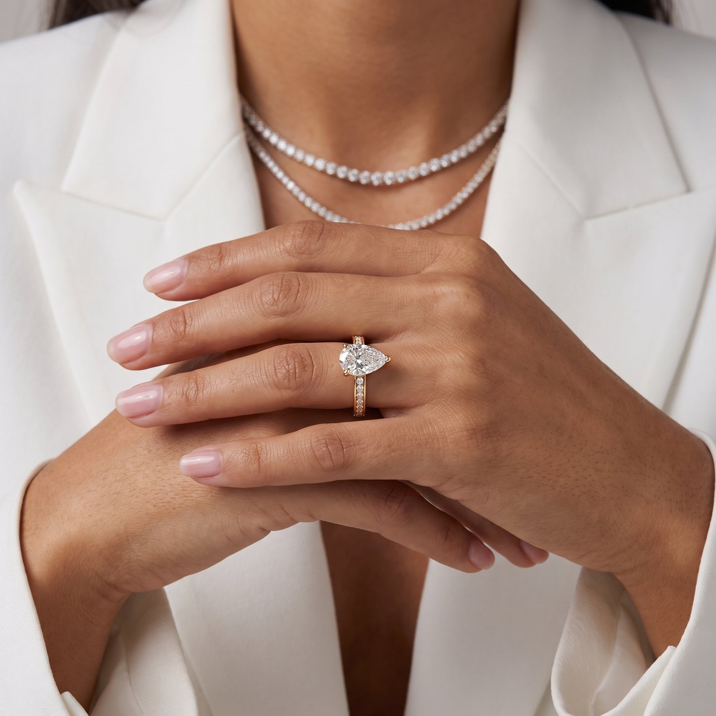 Tessa Solitaire Channel Set Pear Diamond Engagement Ring in Yellow Gold - model.jpg