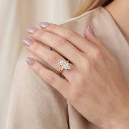 Evie Solitaire Six-Prong Marquise Diamond Engagement Ring in Yellow Gold - model.jpg