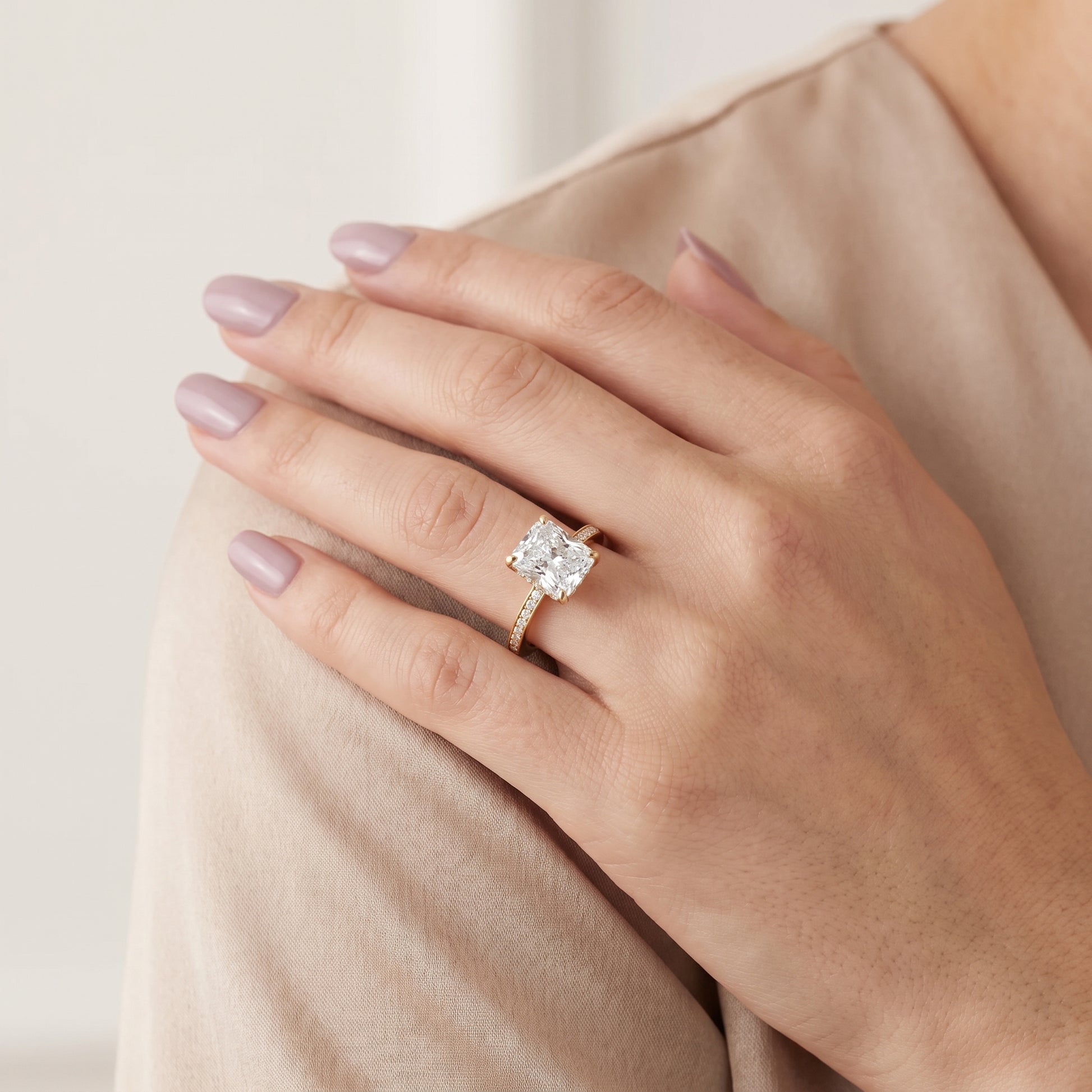 Naia Hidden Halo Radiant Diamond Ring in Yellow Gold - model.jpg