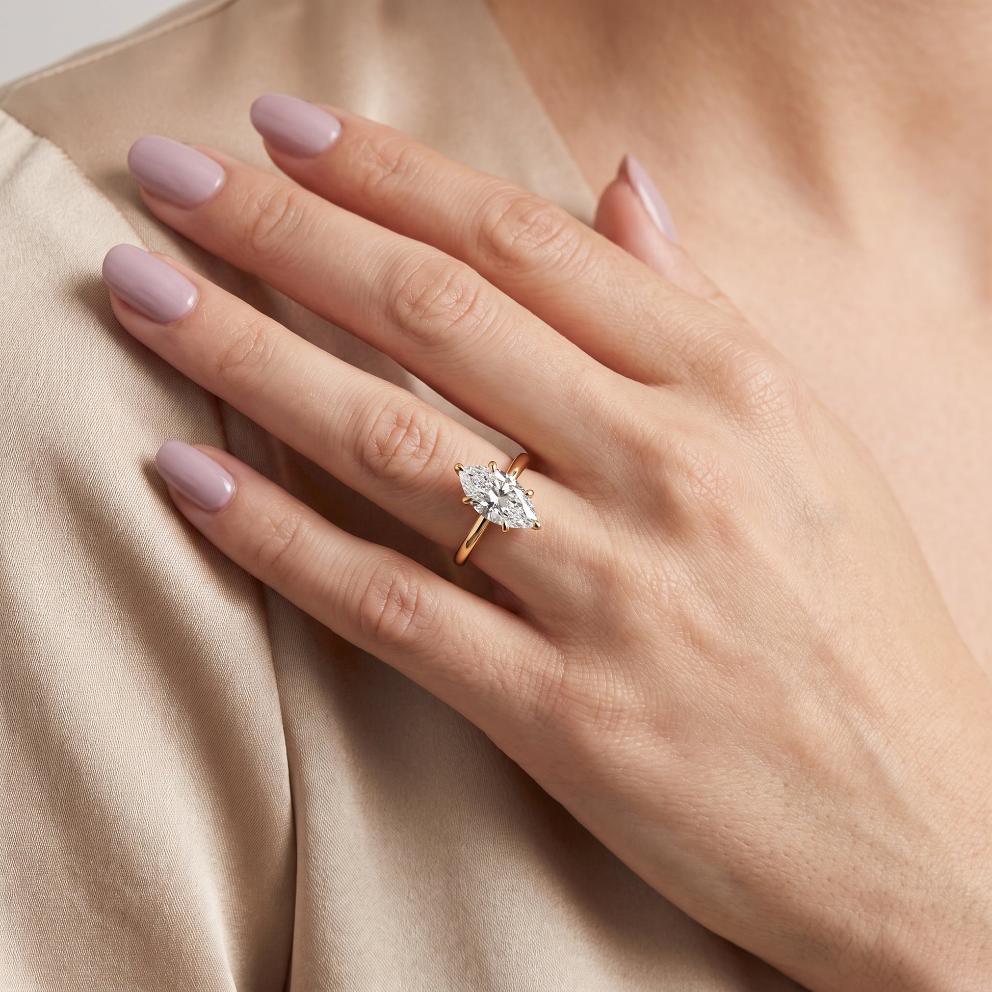 Nella Petite Solitaire Marquise Diamond Engagement Ring in Yellow Gold - model.jpg