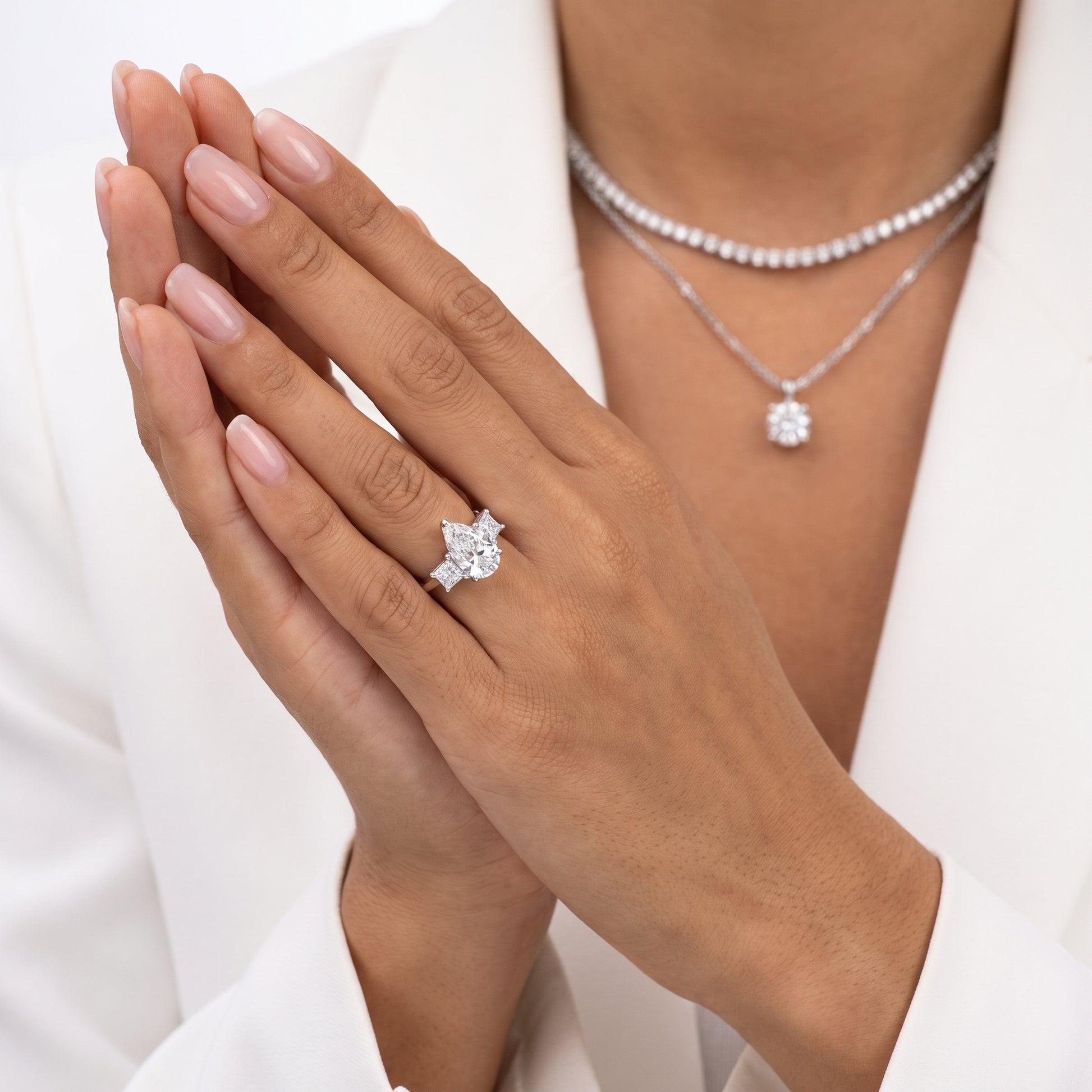 Sienna Three-Stone Pear Diamond Ring in Platinum - model.jpg