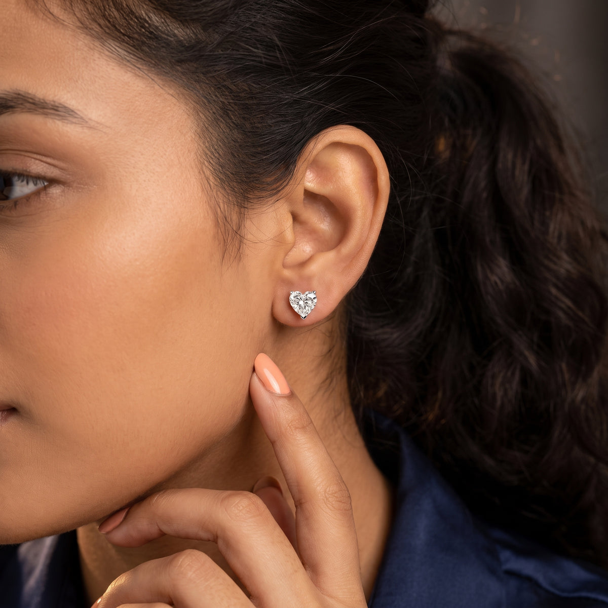 Four Prong Heart Diamond Stud Earrings in Silver - on model