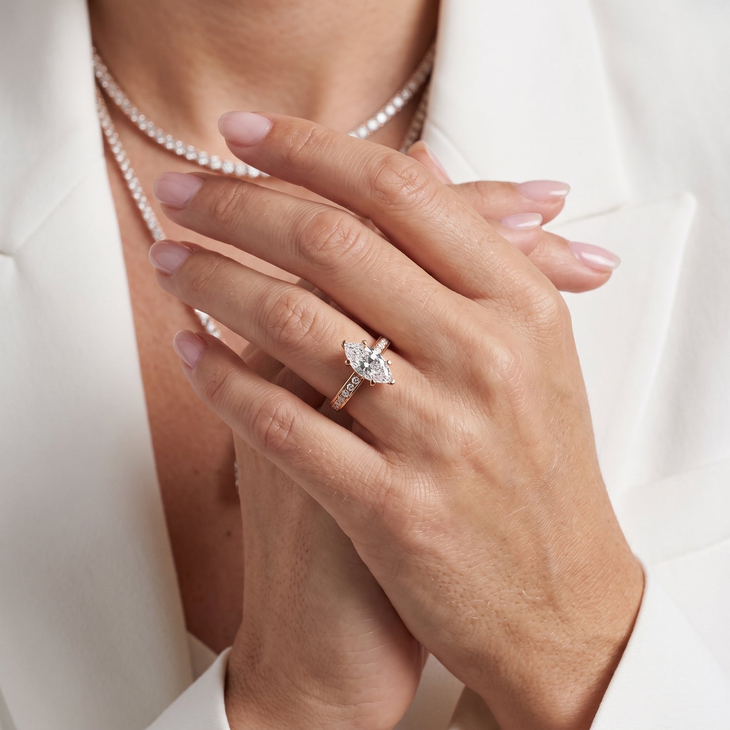 Tessa Solitaire Channel Set Marquise Diamond Engagement Ring in Rose Gold - model.jpg