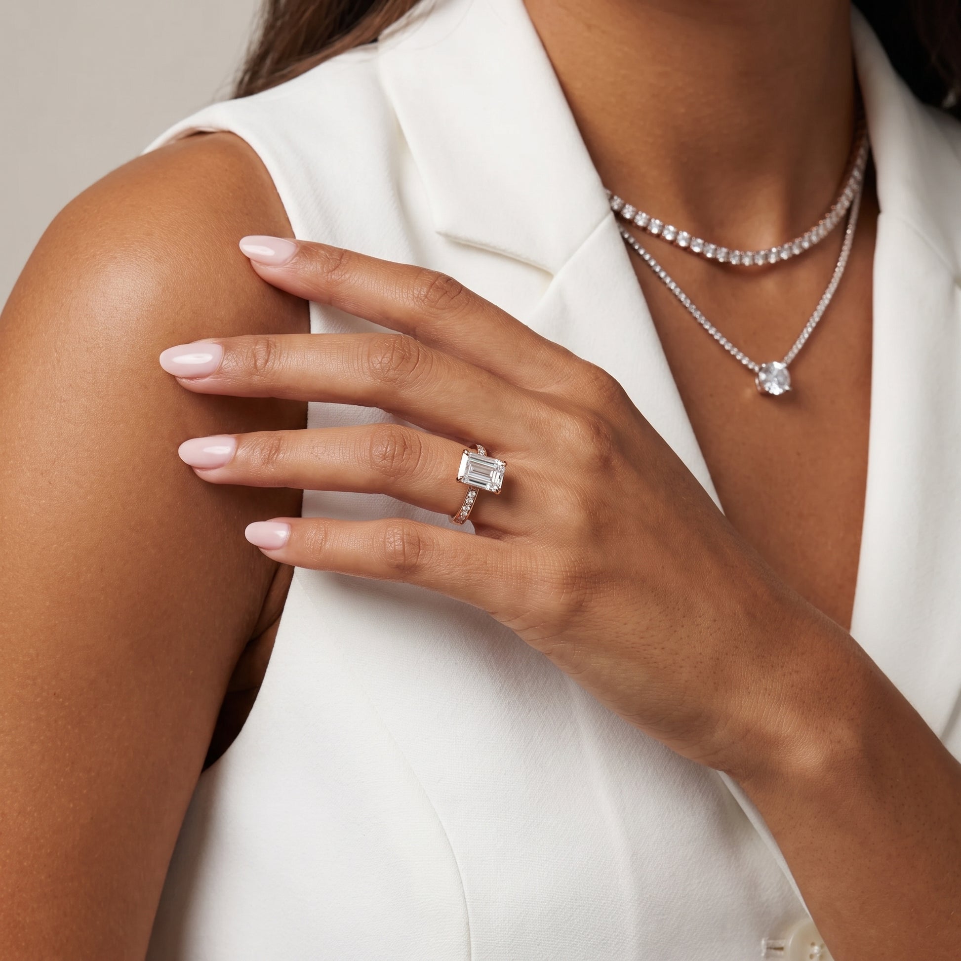 Maren Sidestone Channel Set Emerald Diamond Engagement Ring in Rose Gold - model.jpg