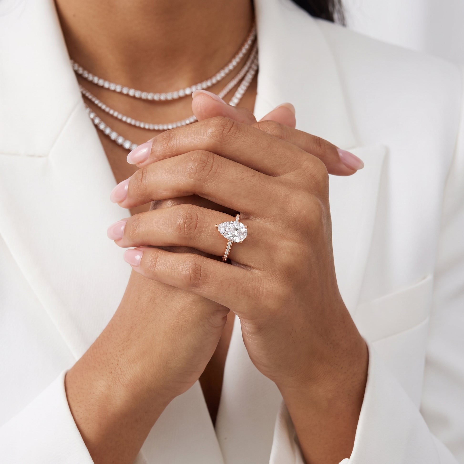 Naia Hidden Halo Pear Diamond Ring in Rose Gold - model.jpg