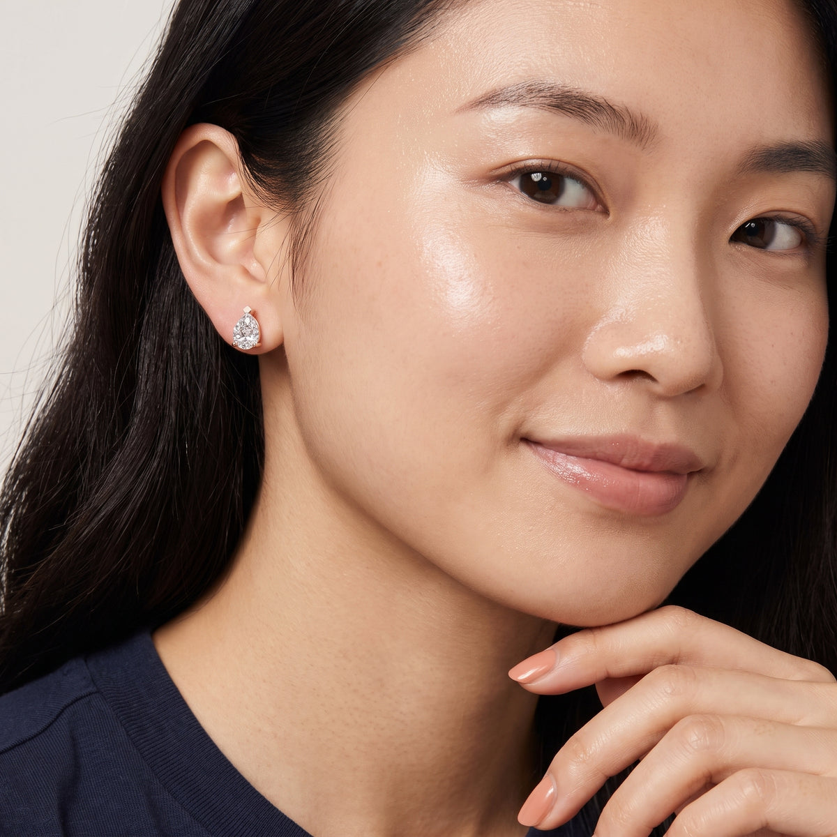 Four Prong Pear Diamond Stud Earrings in Rose Gold - on model