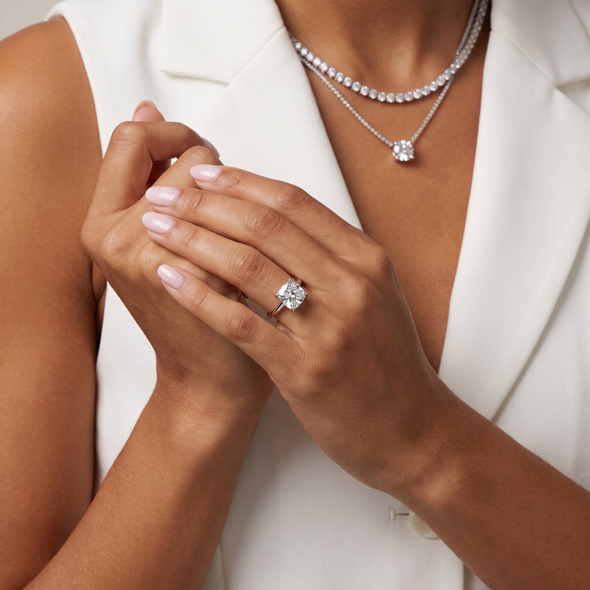 Nella Petite Solitaire Cushion Diamond Engagement Ring in Platinum - model.jpg