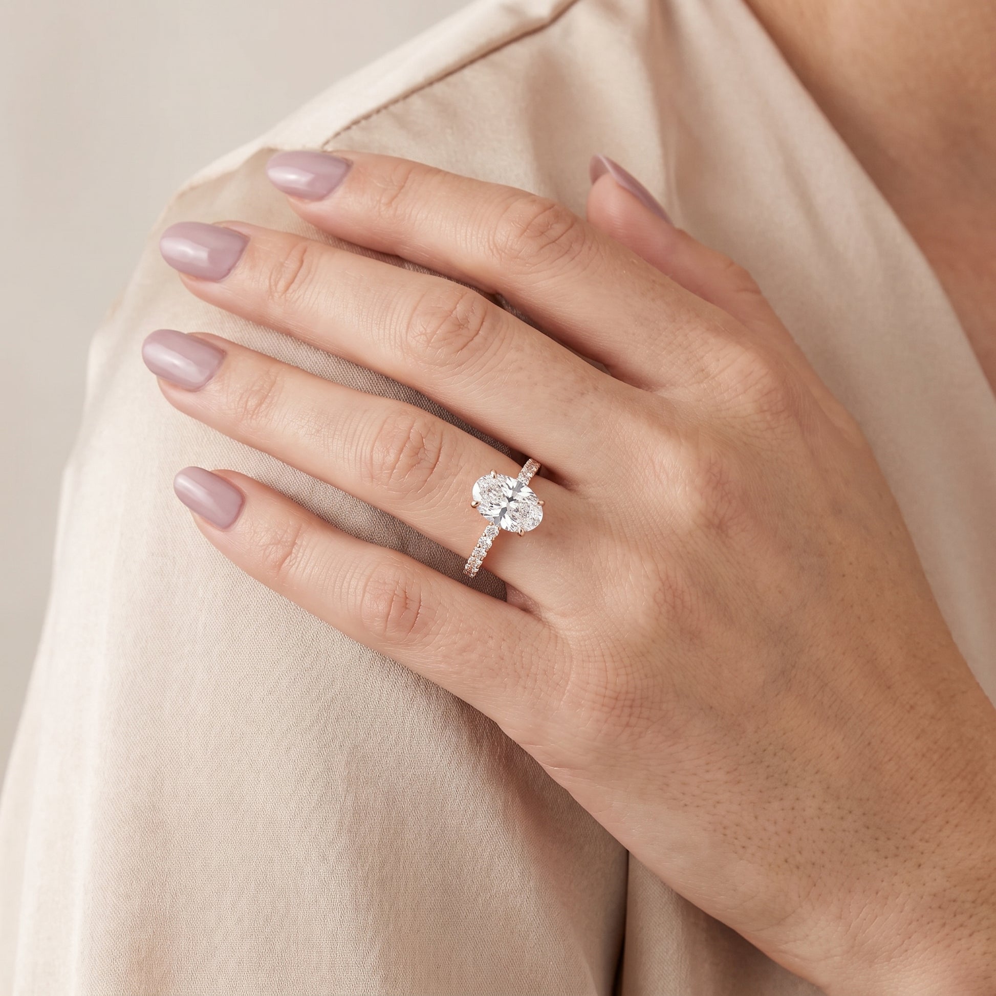 Novara Solitaire Pavé Oval Diamond Ring in Rose Gold - model.jpg