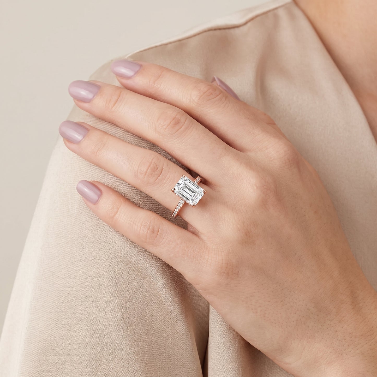 Naia Hidden Halo Emerald Diamond Ring in Rose Gold - model.jpg