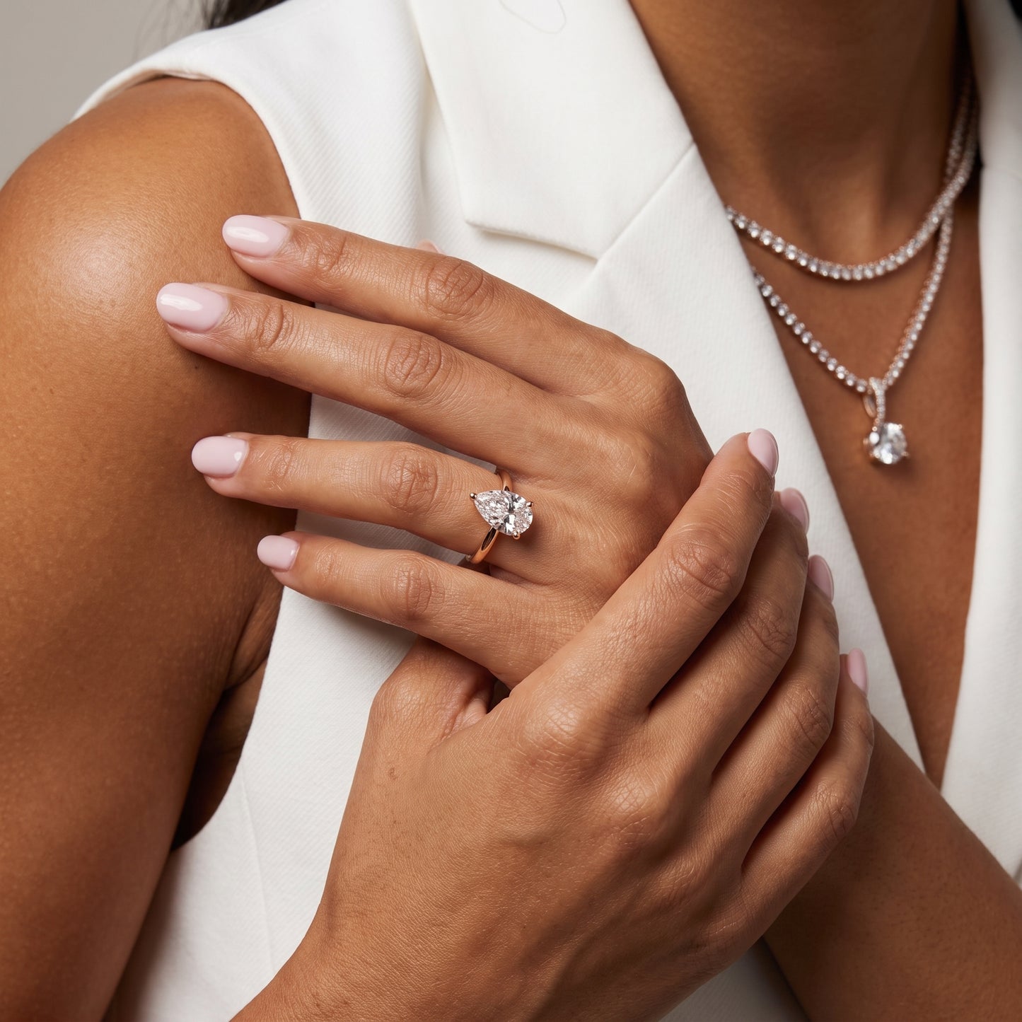 Liana Solitaire Claw Prong Pear Diamond Engagement Ring in Rose Gold - model.jpg