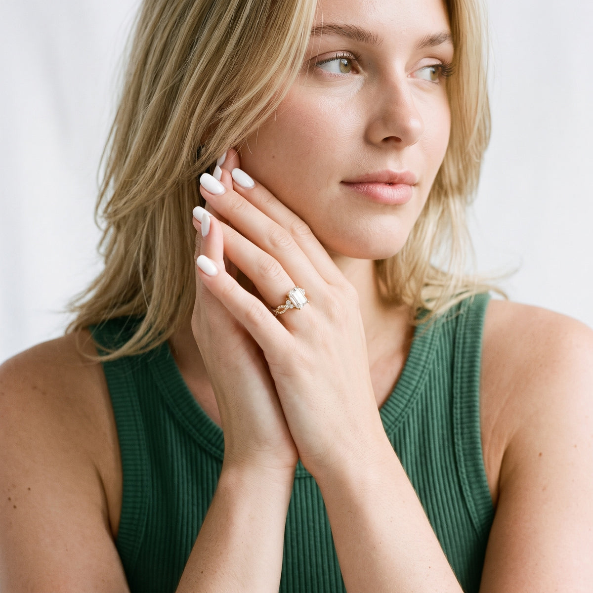 Neva Infinity Twist Emerald Diamond Engagement Ring in Rose Gold - model.jpg