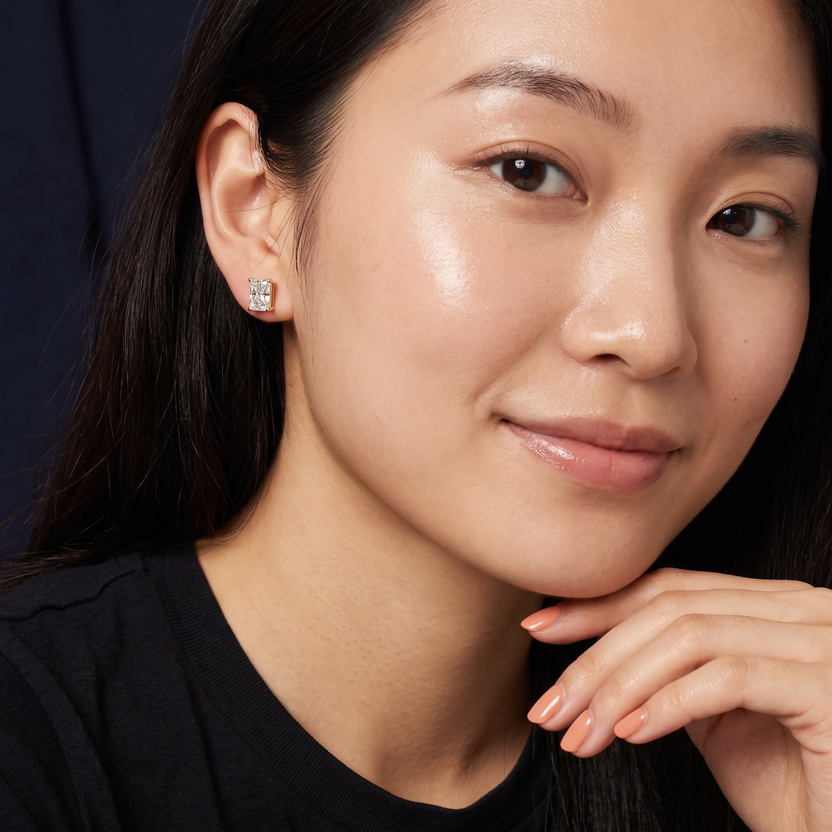 Four Prong Radiant Diamond Stud Earrings in Yellow Gold - on model