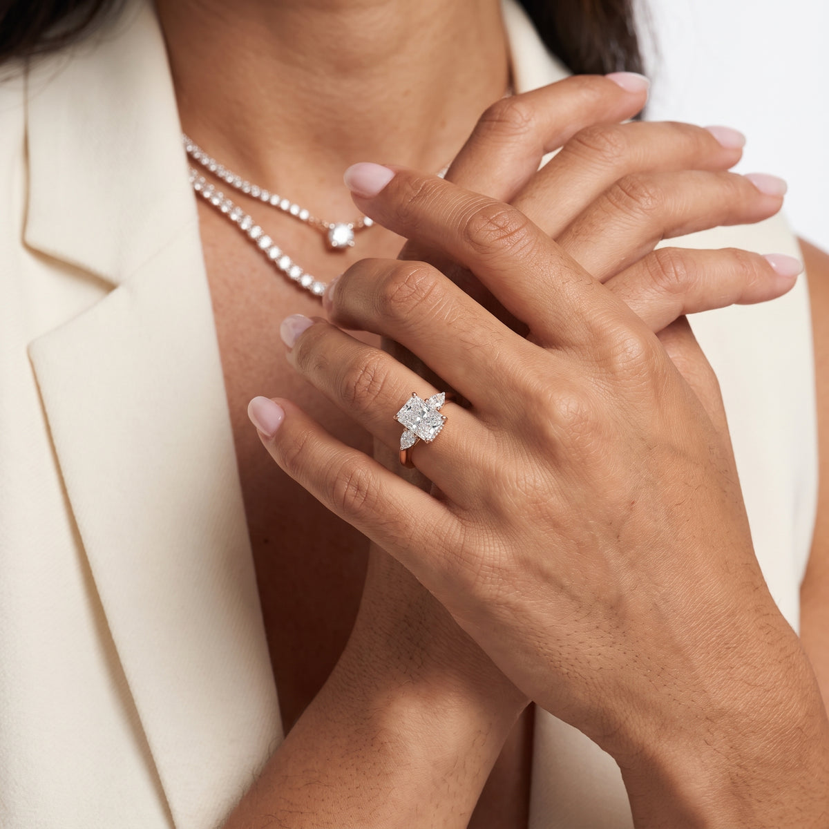 Leila Three-Stone Radiant Diamond Engagement Ring in Rose Gold - model.jpg