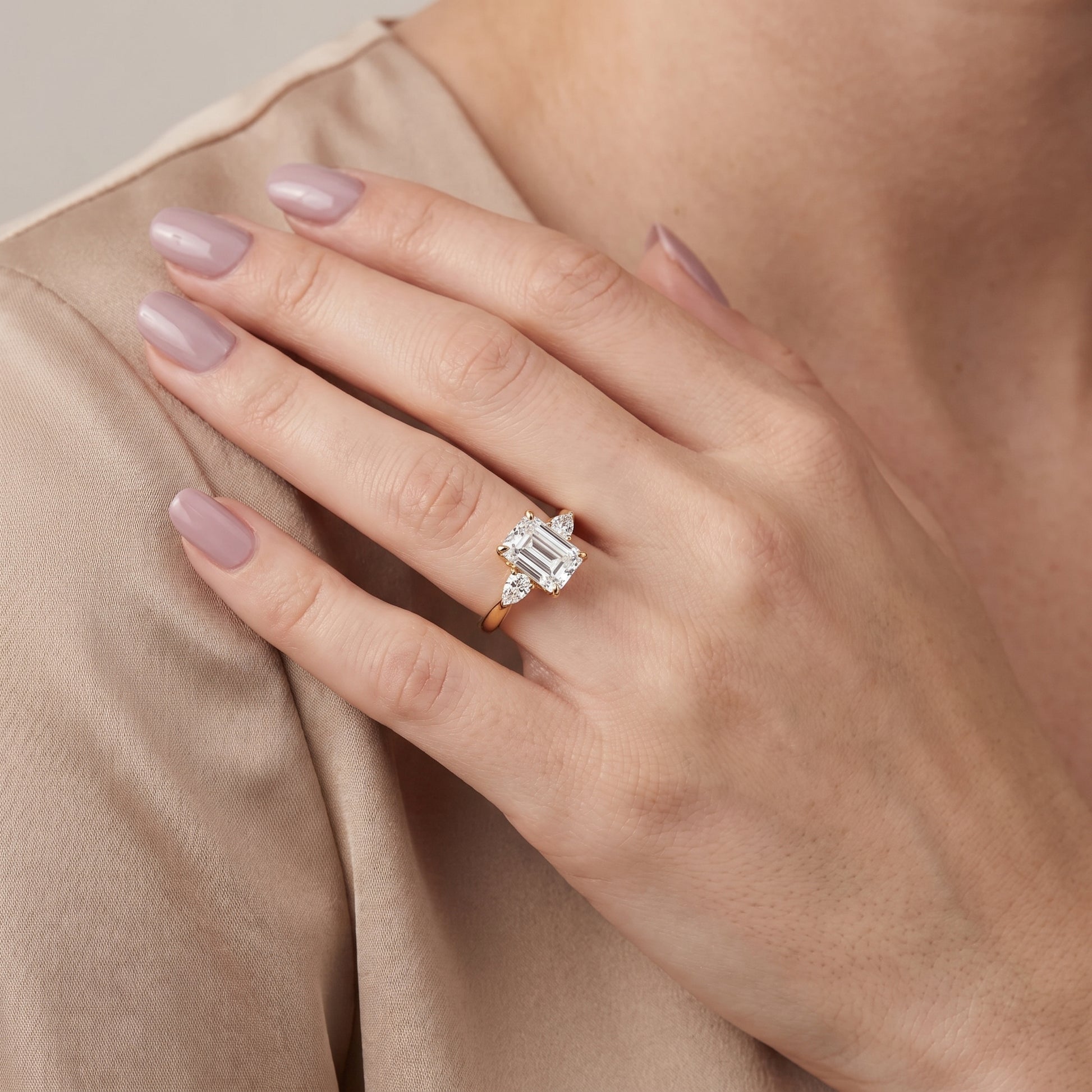 Leila Three-Stone Emerald Diamond Engagement Ring in Yellow Gold - model.jpg