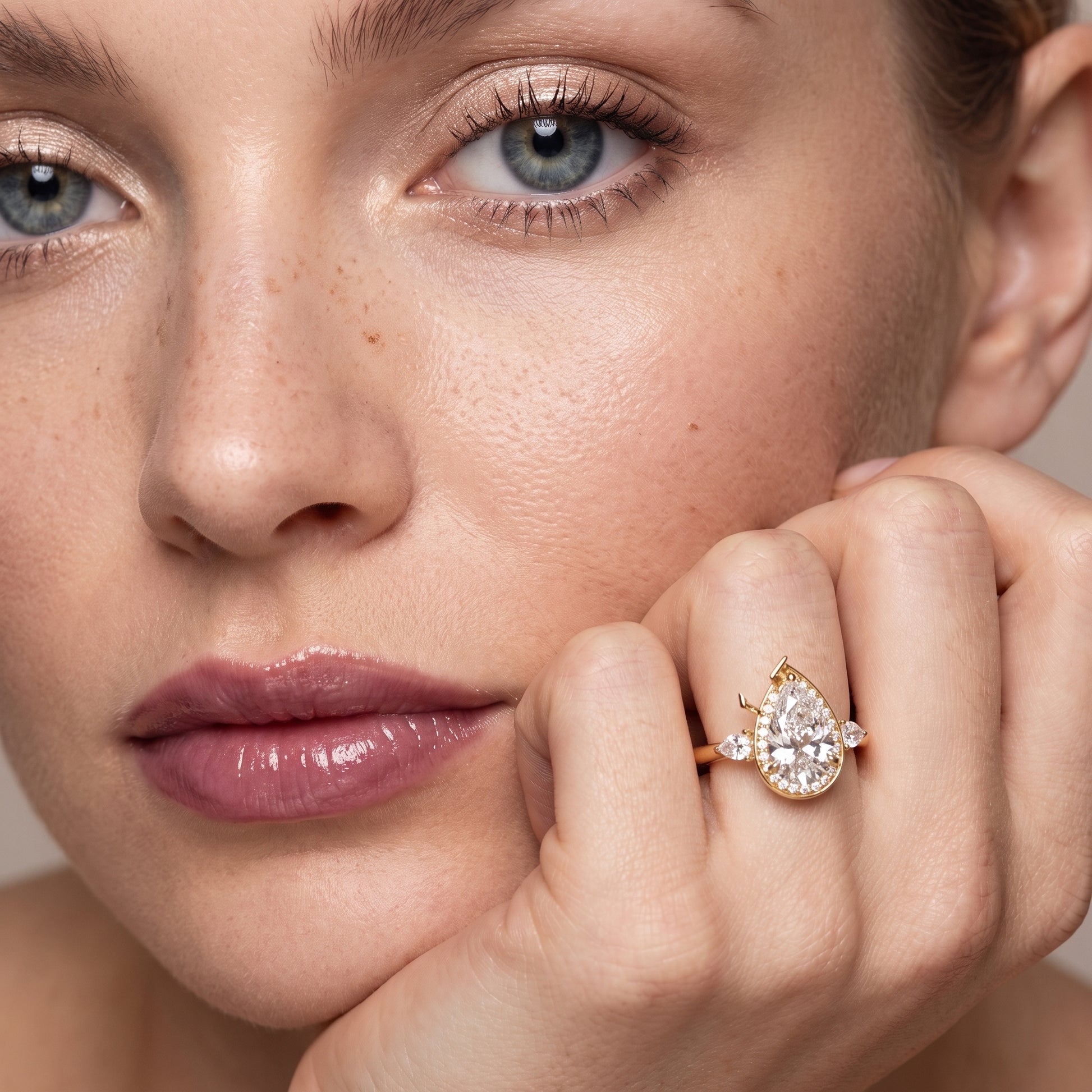 Eliza Halo Sidestone Pear Diamond Engagement Ring in Yellow Gold - model.jpg