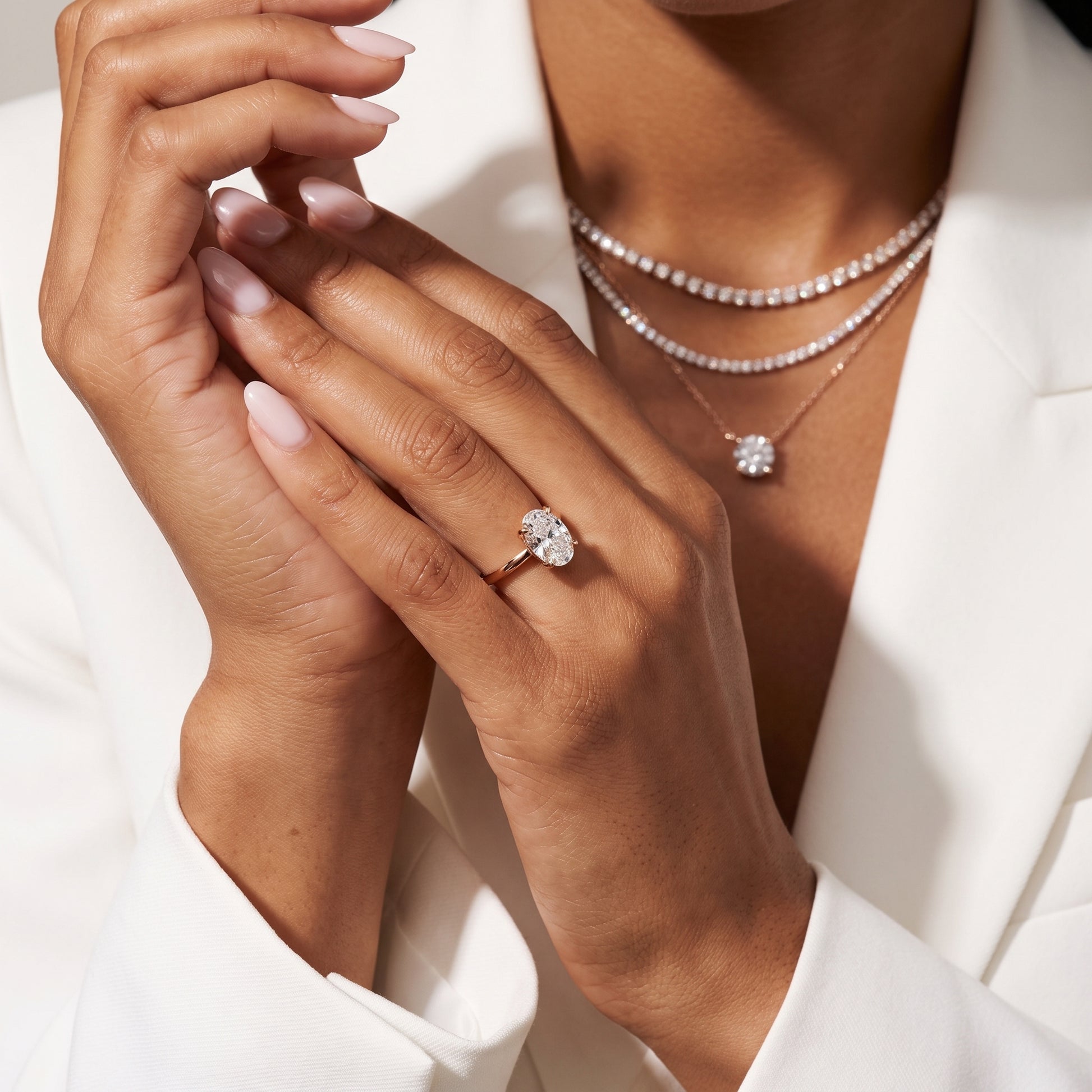 Nella Petite Solitaire Oval Diamond Engagement Ring in Rose Gold - model.jpg