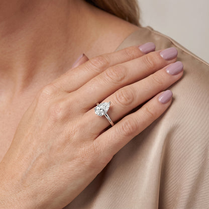Lyla Petite Solitaire Pear Diamond Engagement Ring in Silver - model.jpg